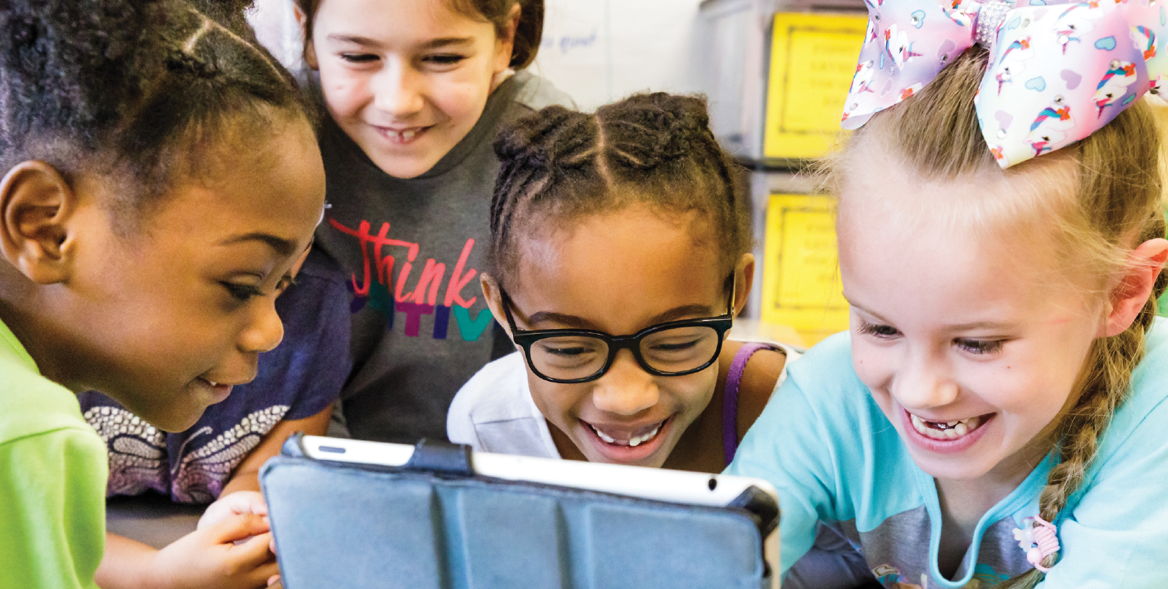 students looking at iPad